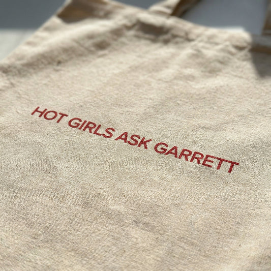 Close-up of the Hot Girls Ask Garrett print on natural canvas