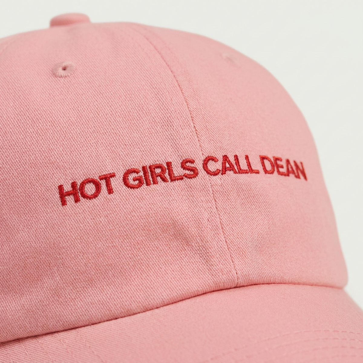 Close-up of the Hot Girls Call Dean embroidery on a dad cap