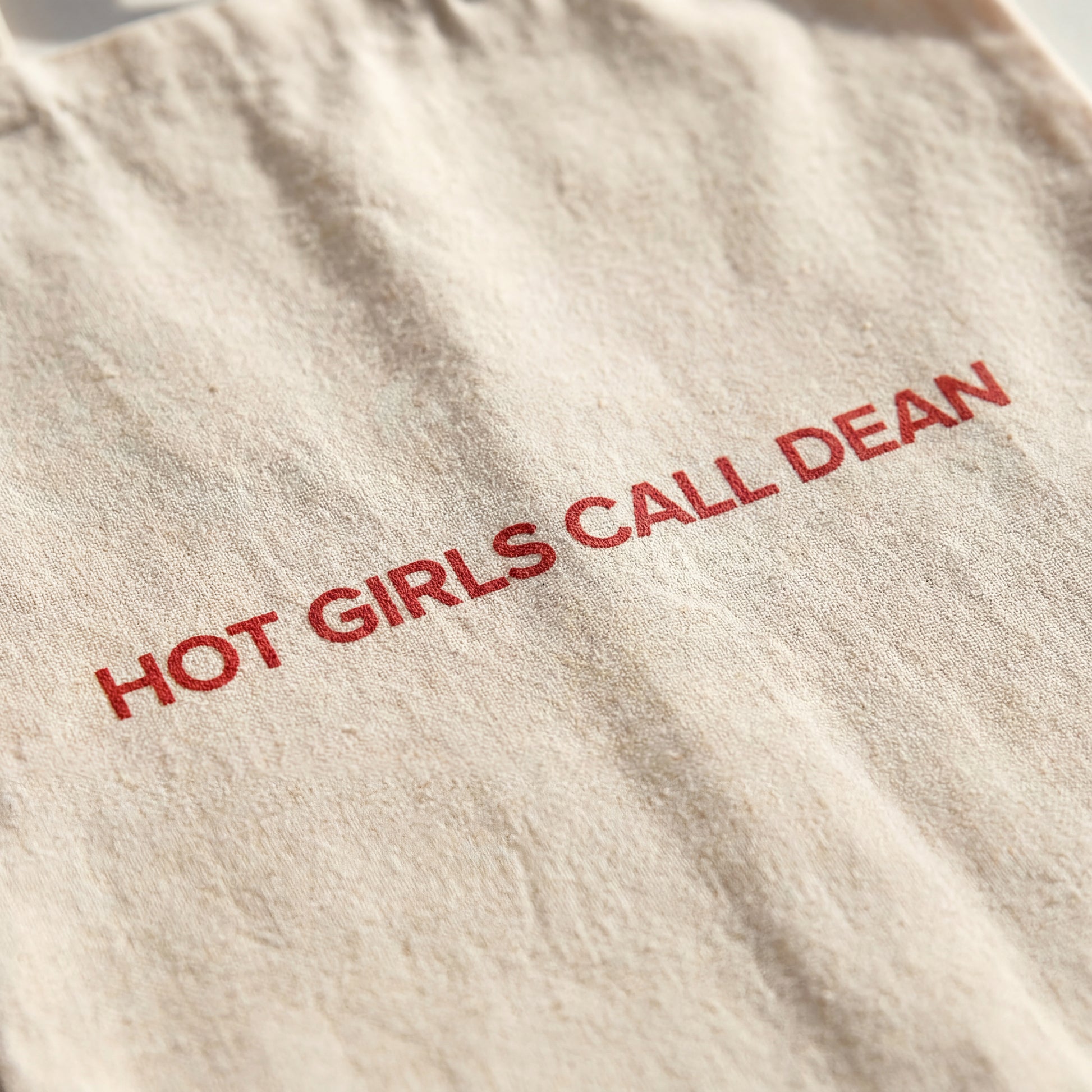 Close-up of the Hot Girls Call Dean print on natural canvas