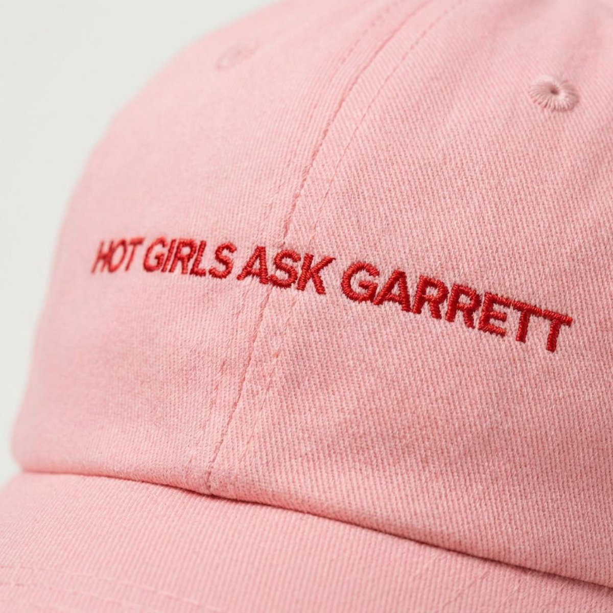 Close-up of the Hot Girls Ask Garrett embroidery on a dad cap