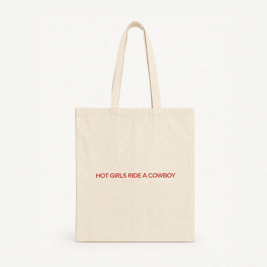 Hot Girls Ride a Cowboy natural cotton tote bag in brand red, cowboy romance merch by After Hours Book Club